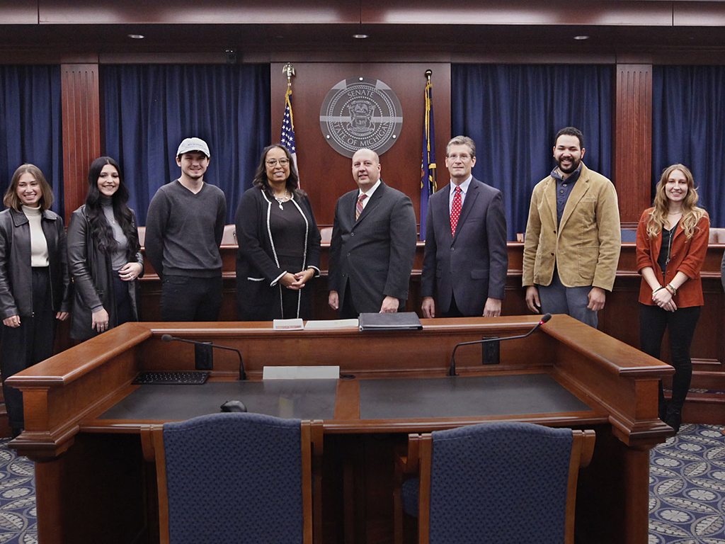 SVSU art student Austin Kemp (2nd from right) with state legislators in Lansing MI 2021